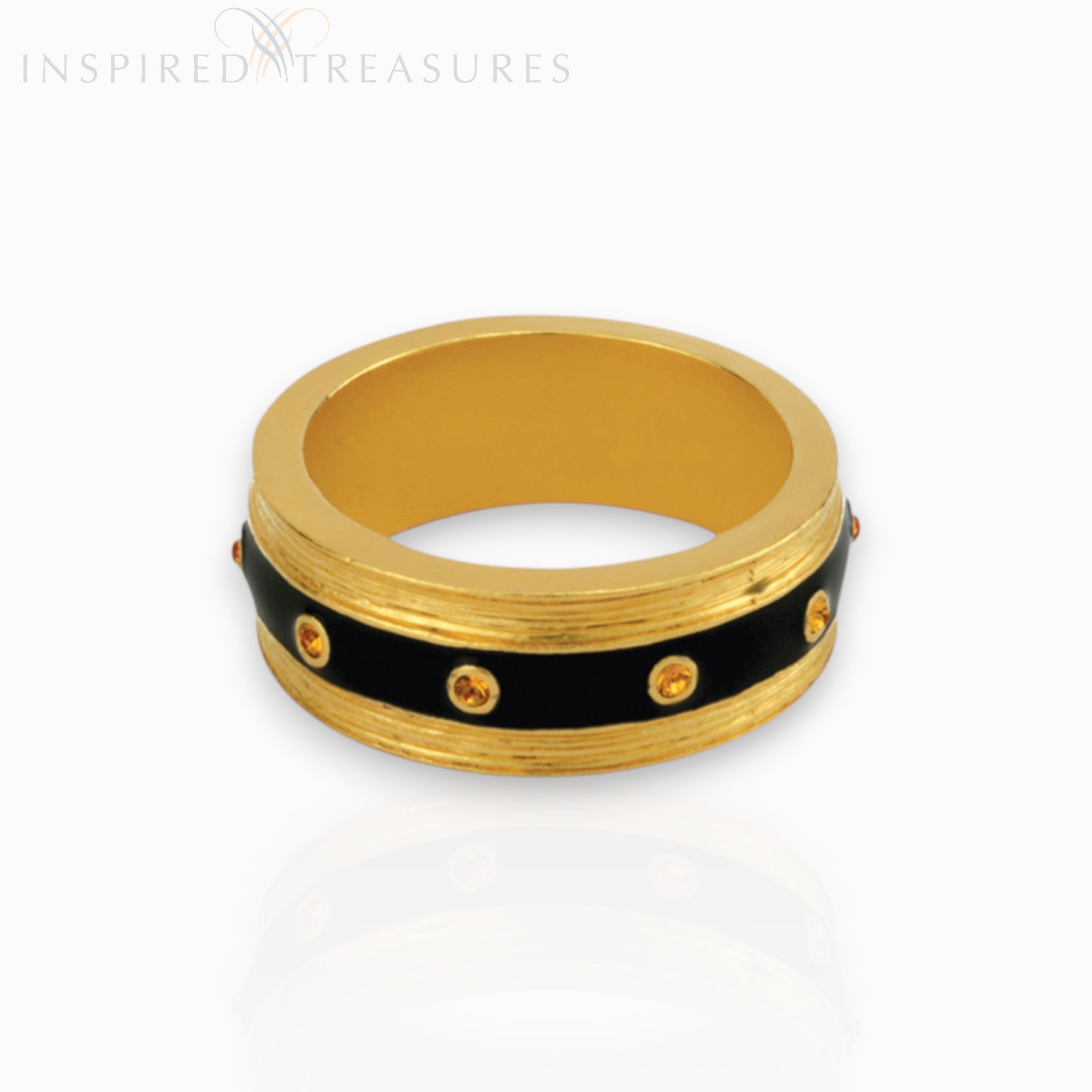 Gold ring with black band and small stones on a white background