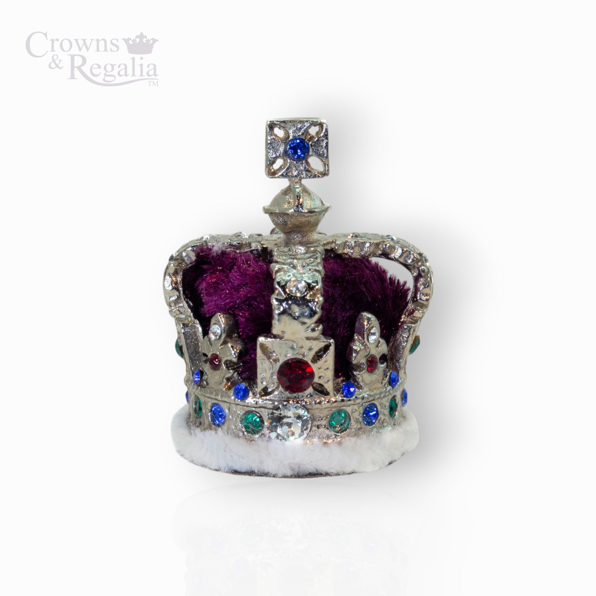Decorative crown with colorful gemstones on a white background, branded 'Crowns & Regalia'.
