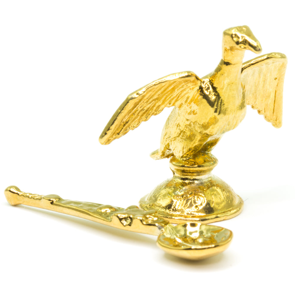 Miniature Regalia - The Ampulla and Spoon on a white background.