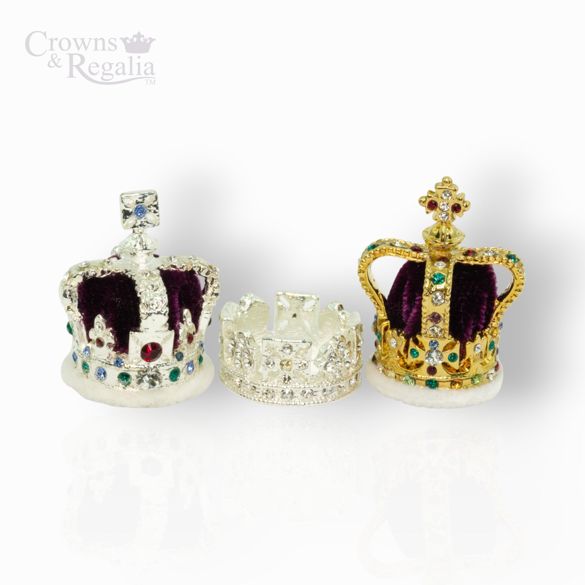 Three decorative crowns with gemstones on a white background, branded 'Crowns & Regalia'.