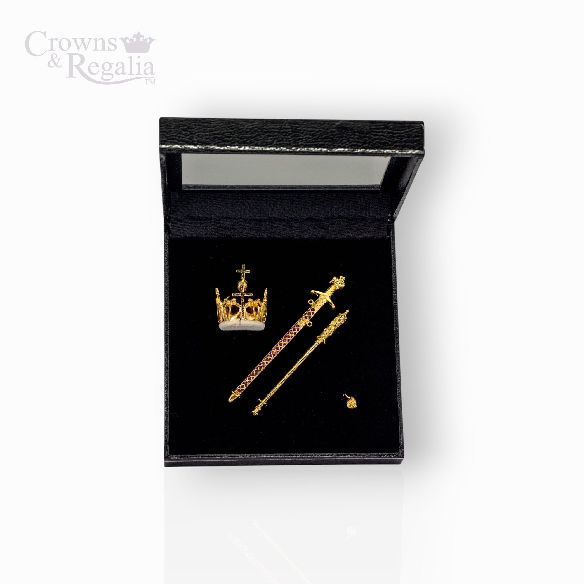 Gold crown and scepters in a black display box with 'Crowns & Regalia' branding.