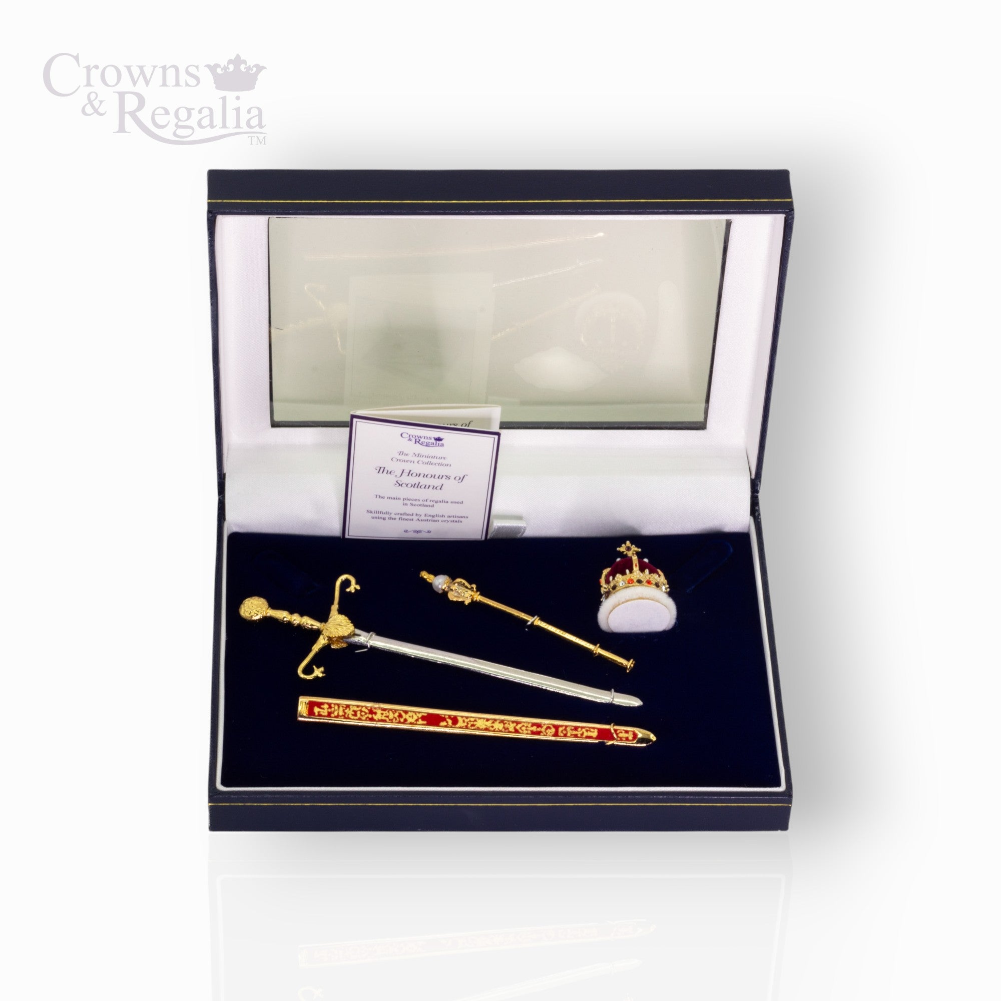 Crown miniatures on a black display box with 'Crowns & Regalia' branding.
