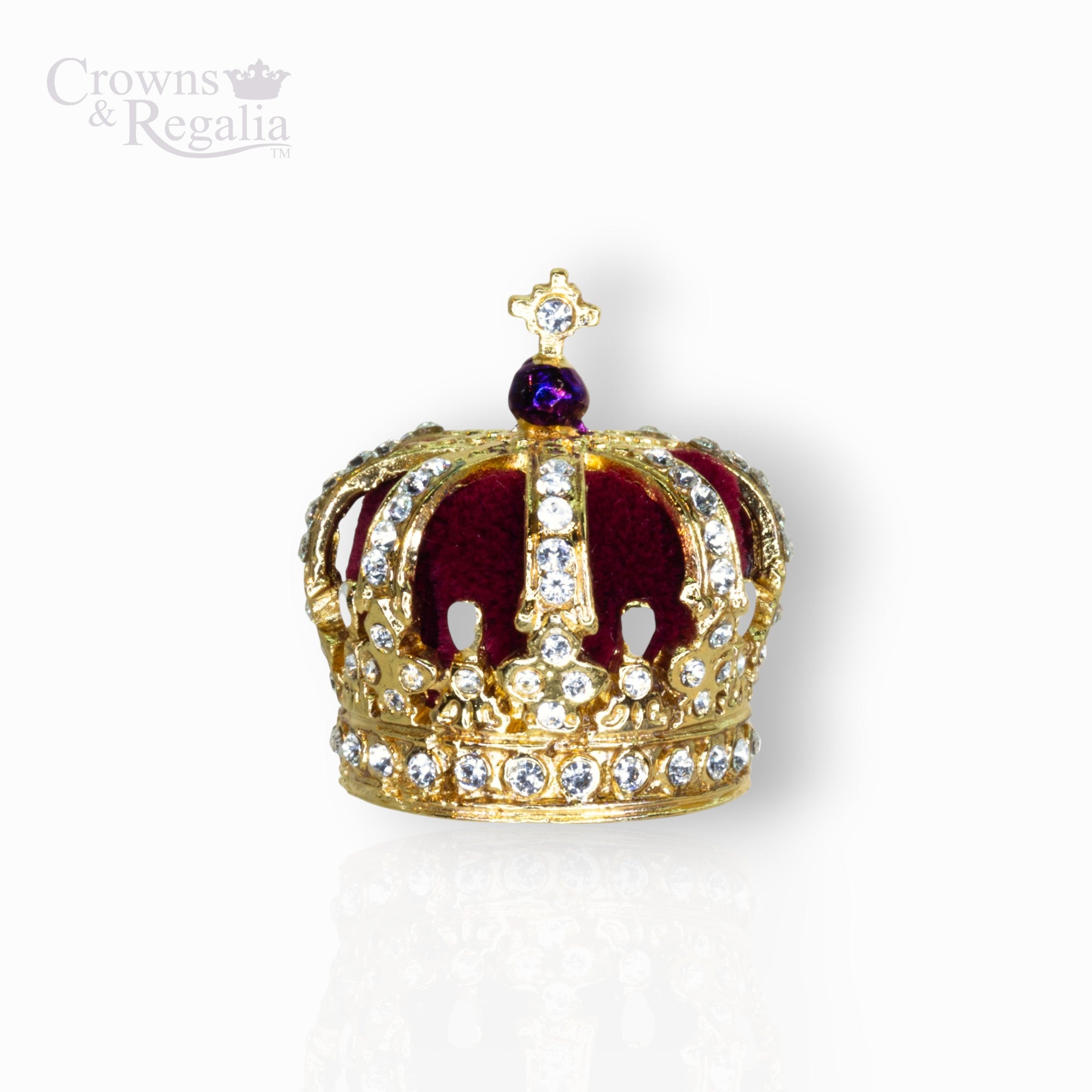 Decorative crown with red center and gold border on a white background, branded 'Crowns & Regalia'.