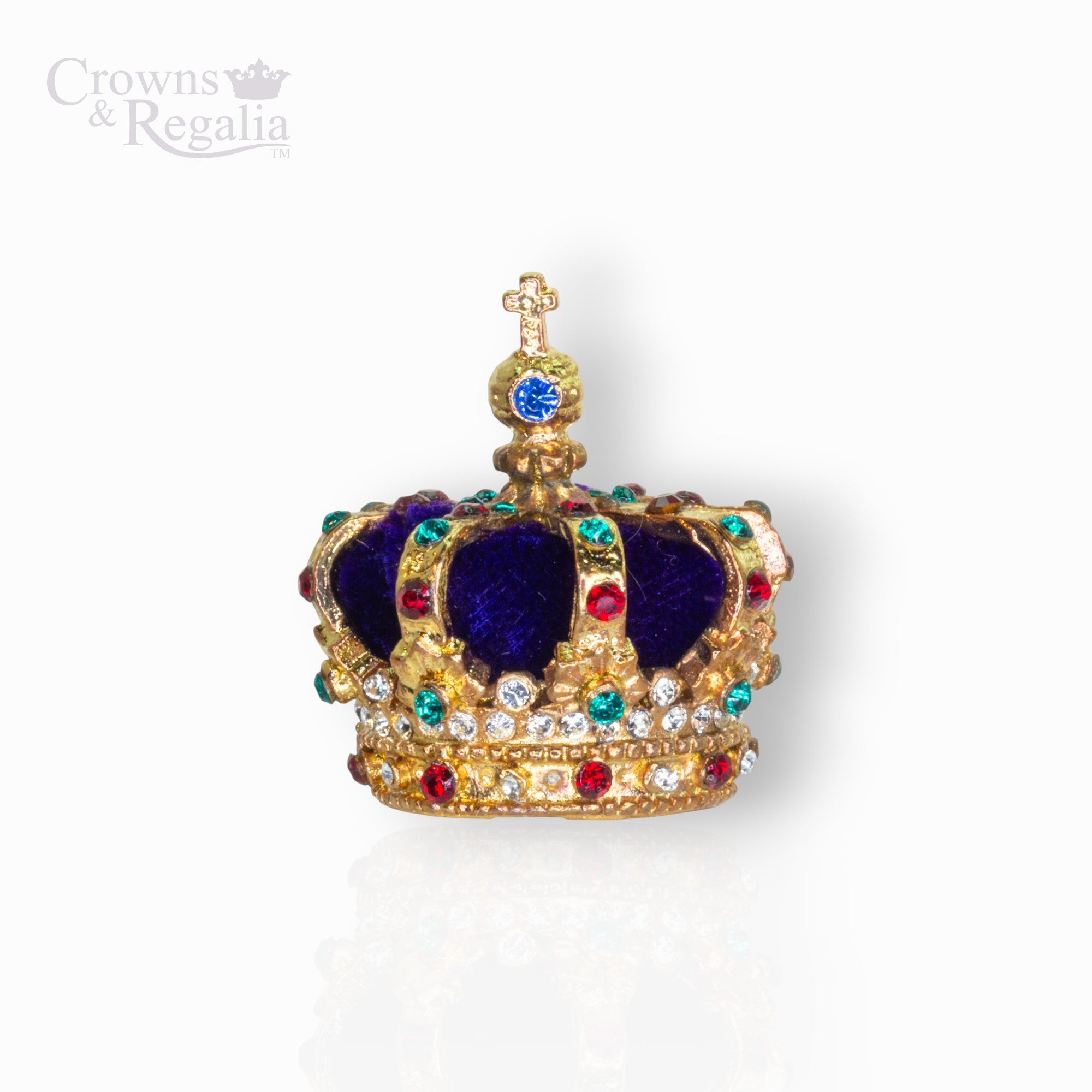 Decorative crown with blue velvet center and gold, red, and green jewels on a white background.