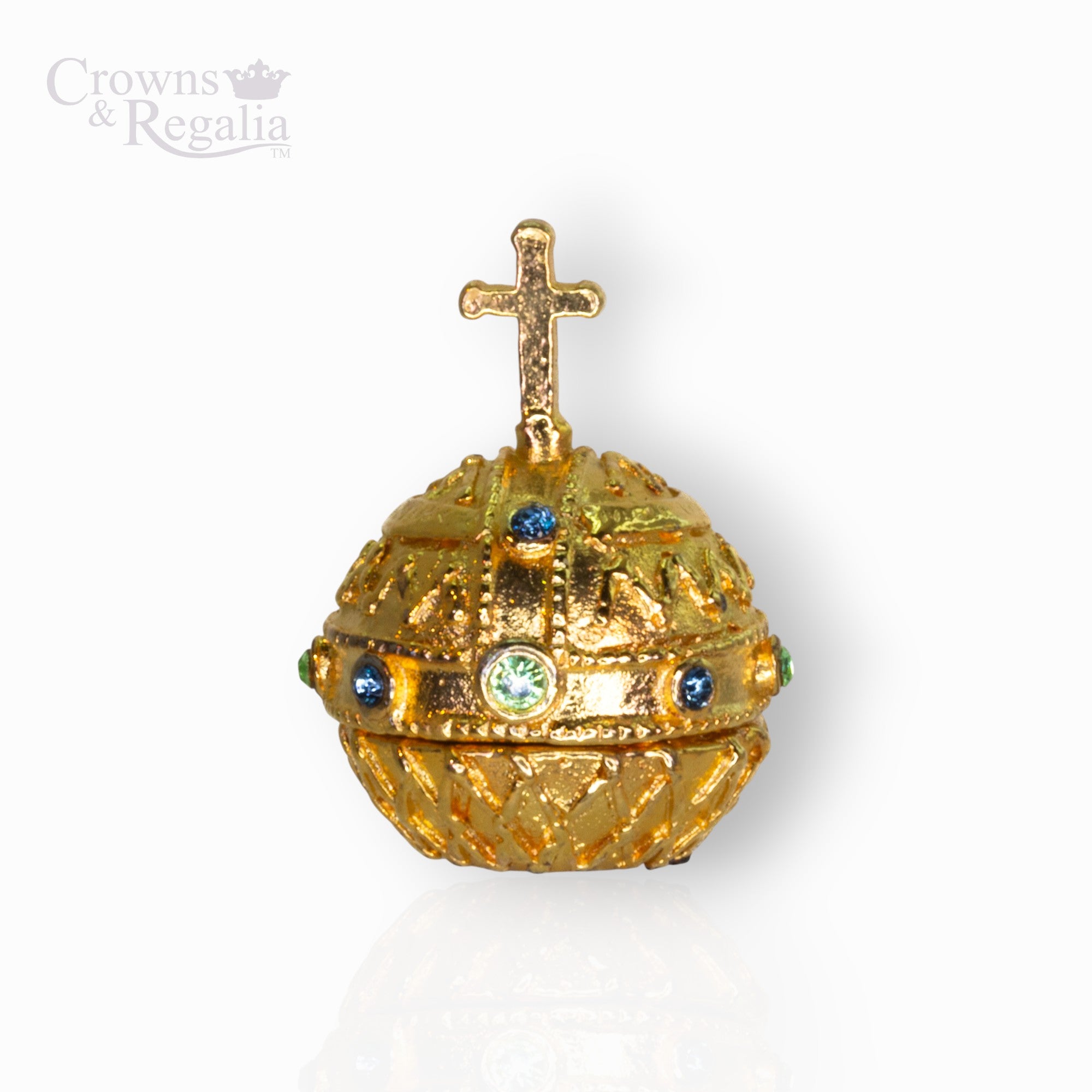 Decorative gold orb with a cross on top, featuring gemstones, against a white background. Brand 'Crowns & Regalia' visible.