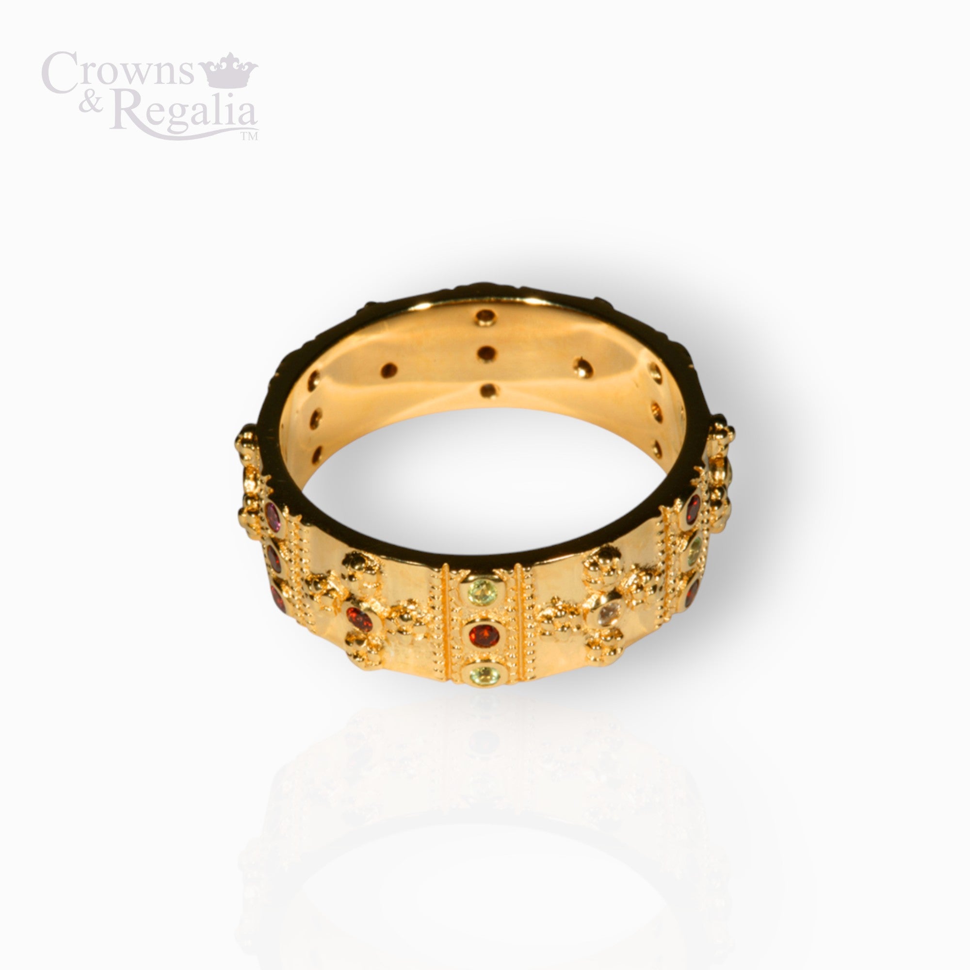 Gold ring with gemstones on a white background, branded 'Crowns & Regalia'.