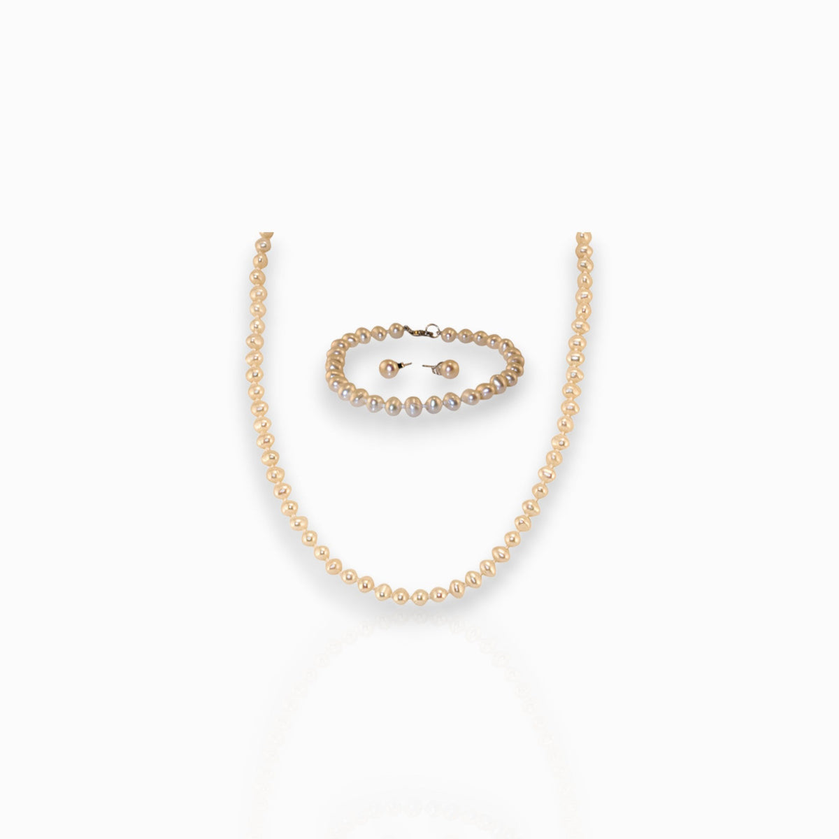 Small Pearl Necklace, Bracelet and Single Pearl -Earrings on a white background.