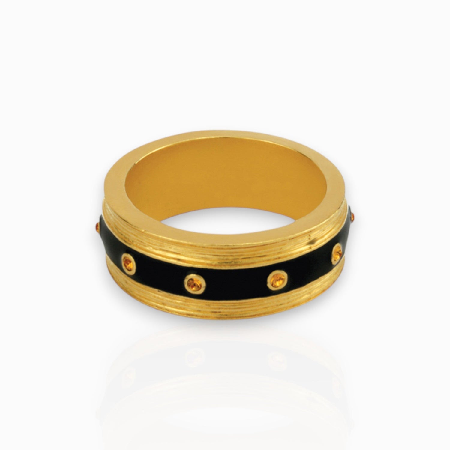 Gold ring with black band and small stones on a white background