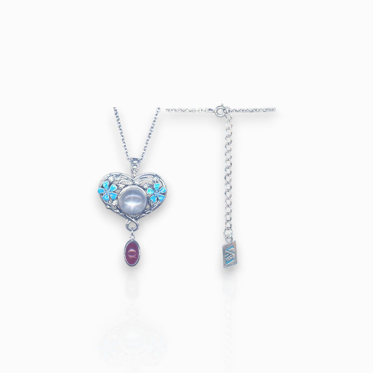 Silver Heart & Flower - Pendant on a white background.