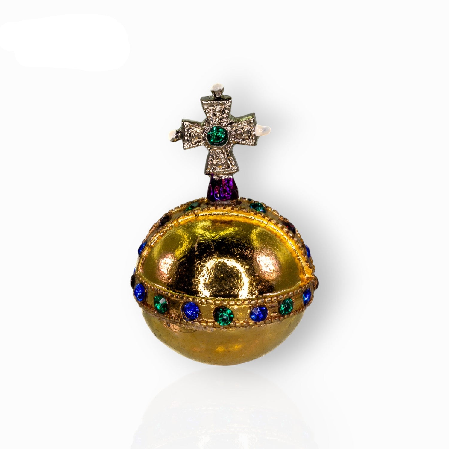 Decorative miniature orb with gemstones on a white background.