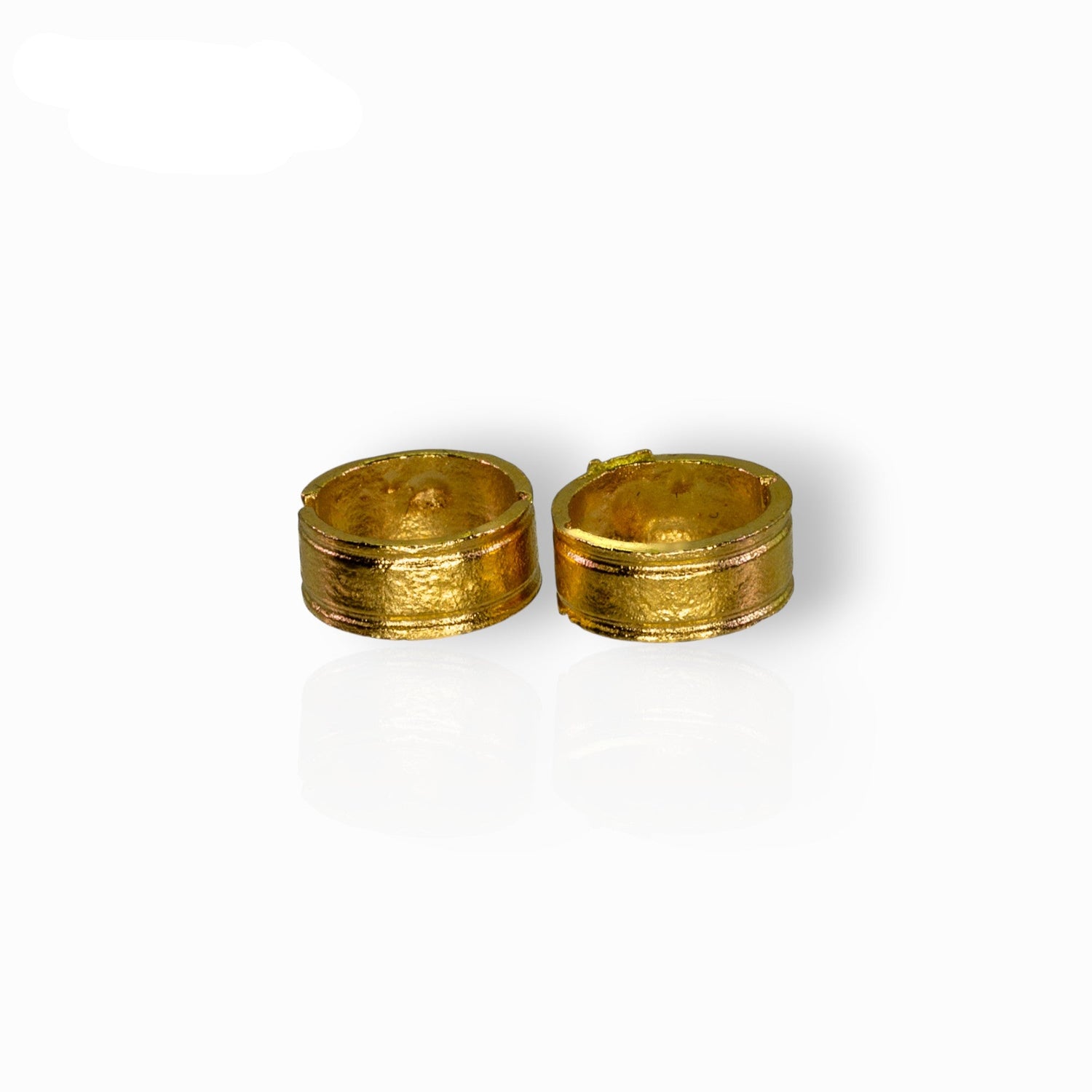 Two gold miniature hoops on a white background.