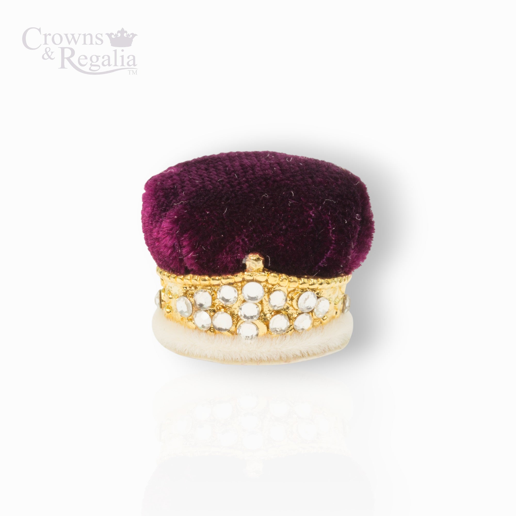 Purple velvet box with gold and white embellishments on a white background, branded 'Crowns & Regalia'.