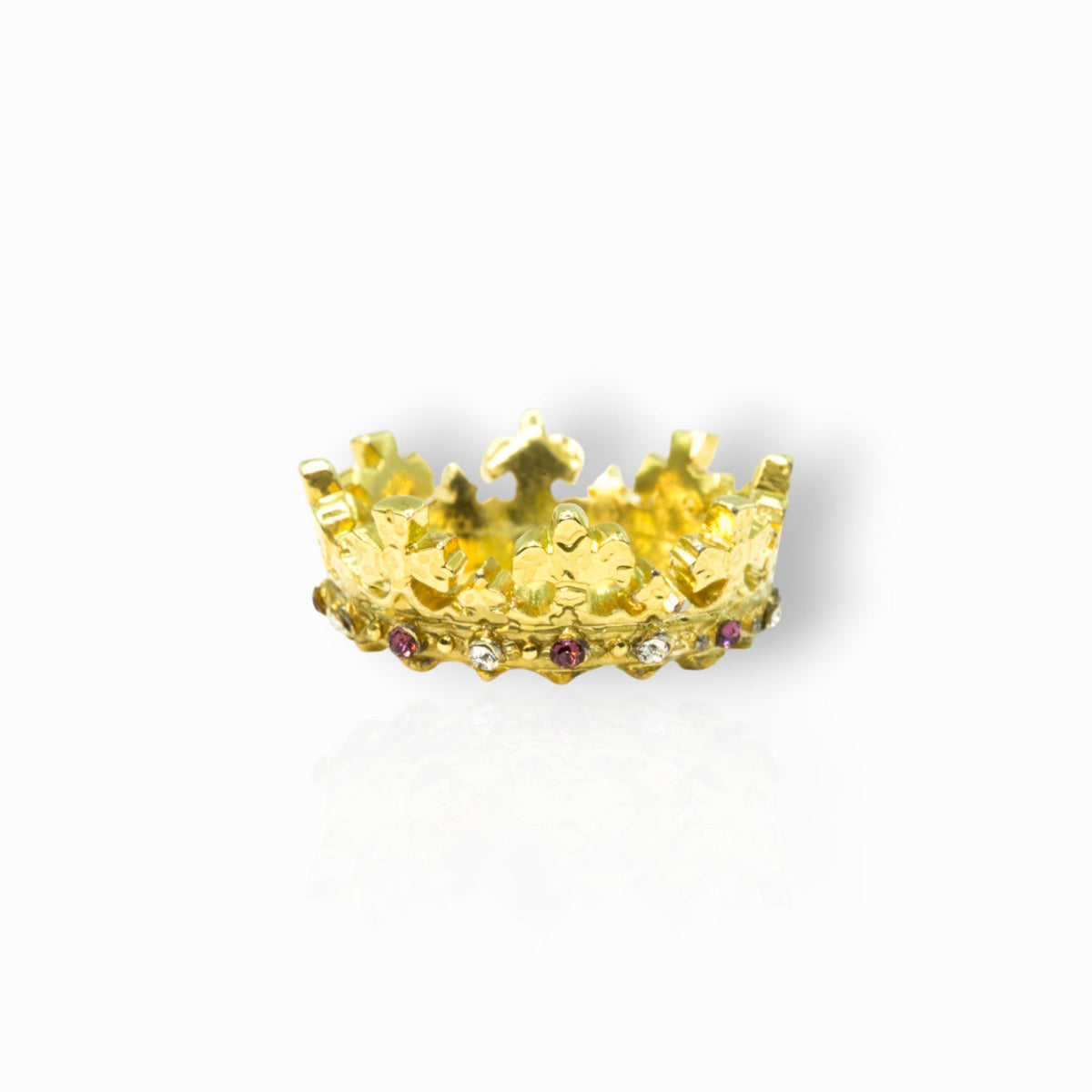 Gold crown with gemstones on a white background.