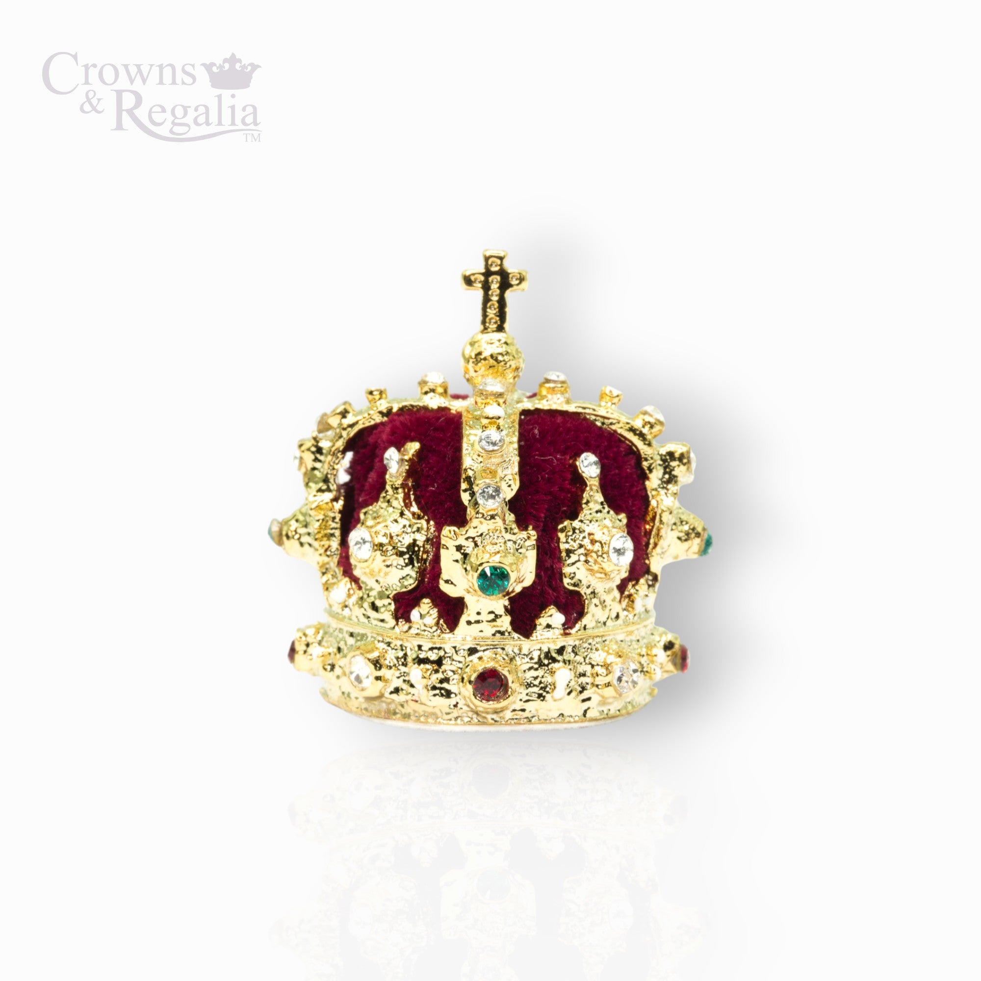Gold crown with red center and gemstones on a white background, branded 'Crowns & Regalia'.