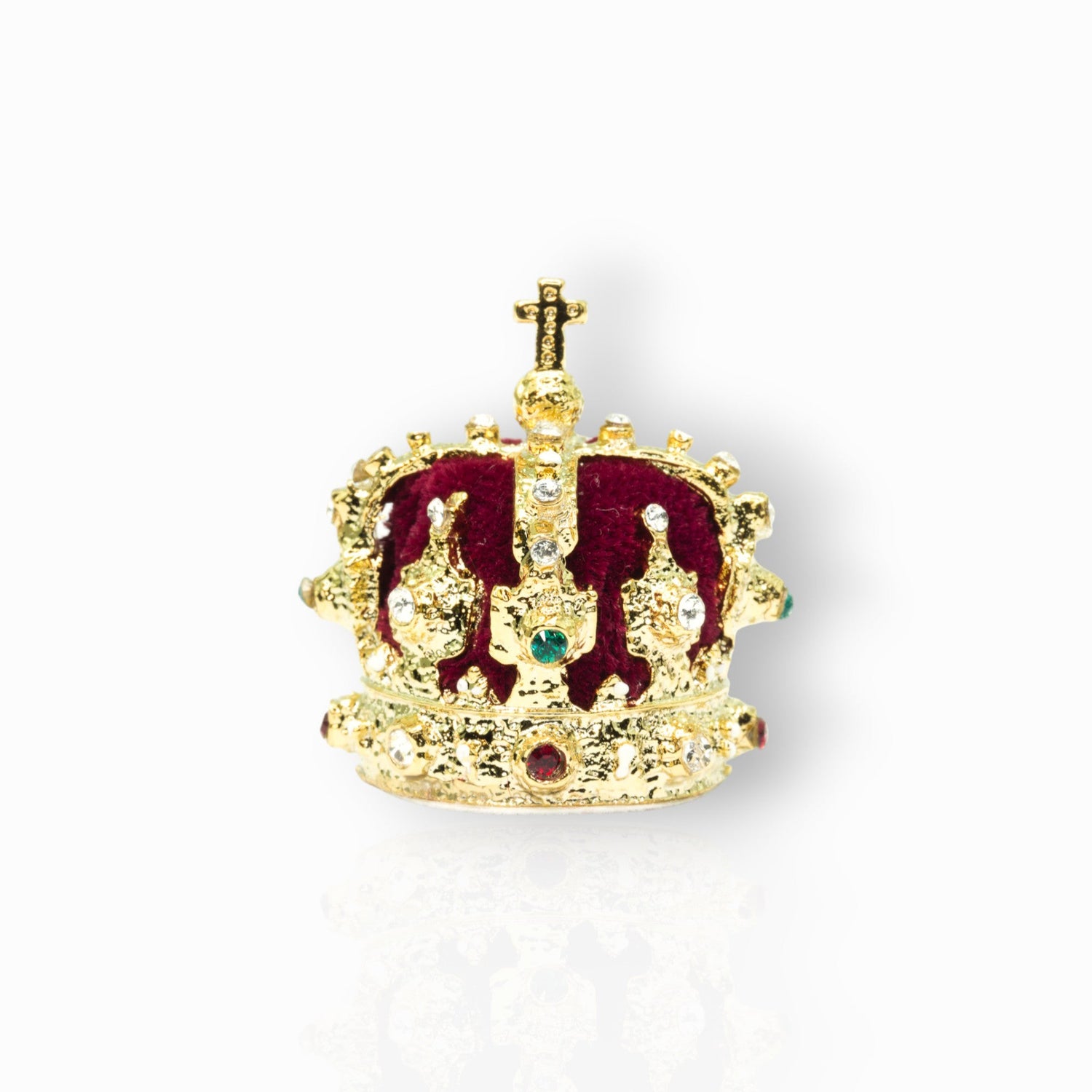 Gold crown with red center and gemstones on a white background.