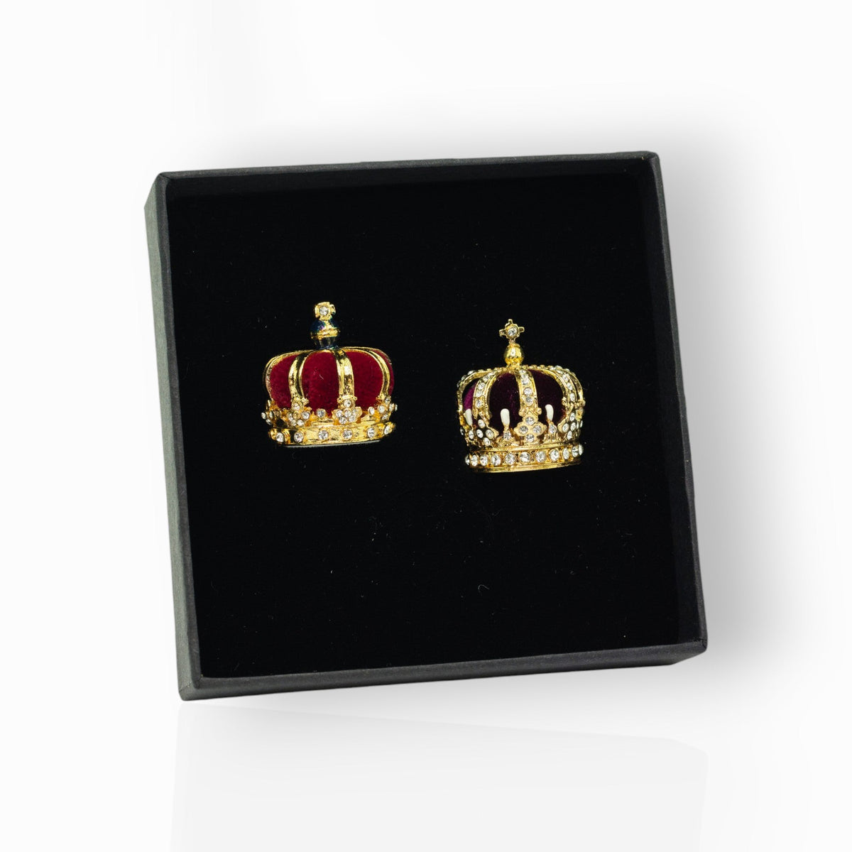 Crown miniatures on a black display box.