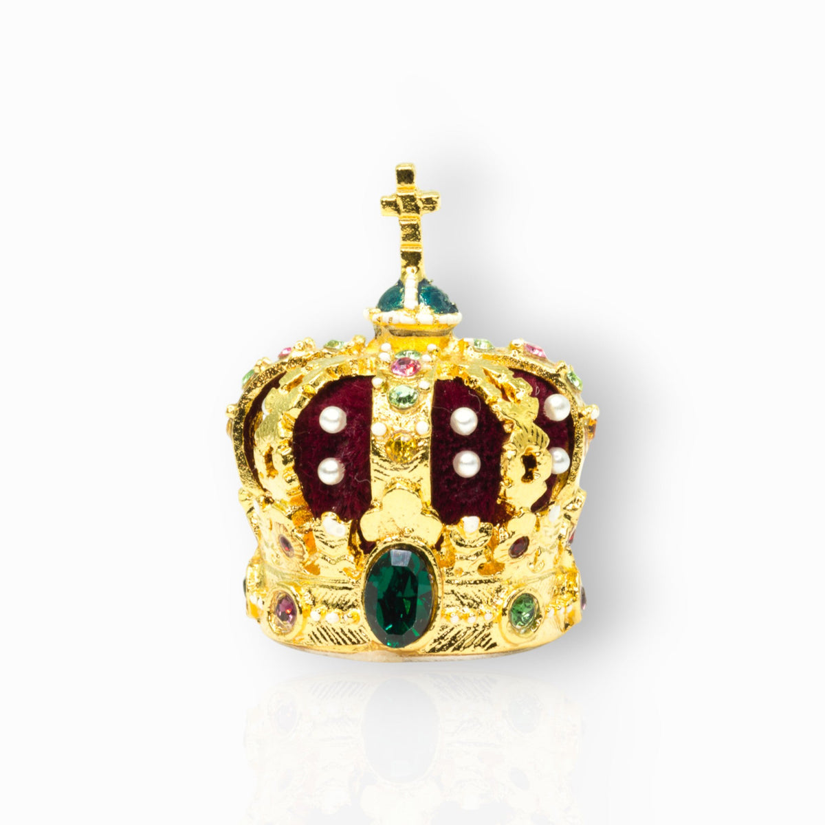 Gold crown with gemstones on a white background.
