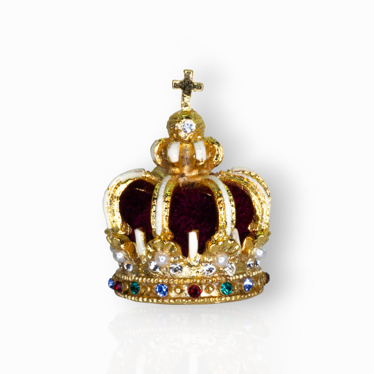 Gold crown with colorful gemstones on a white background.