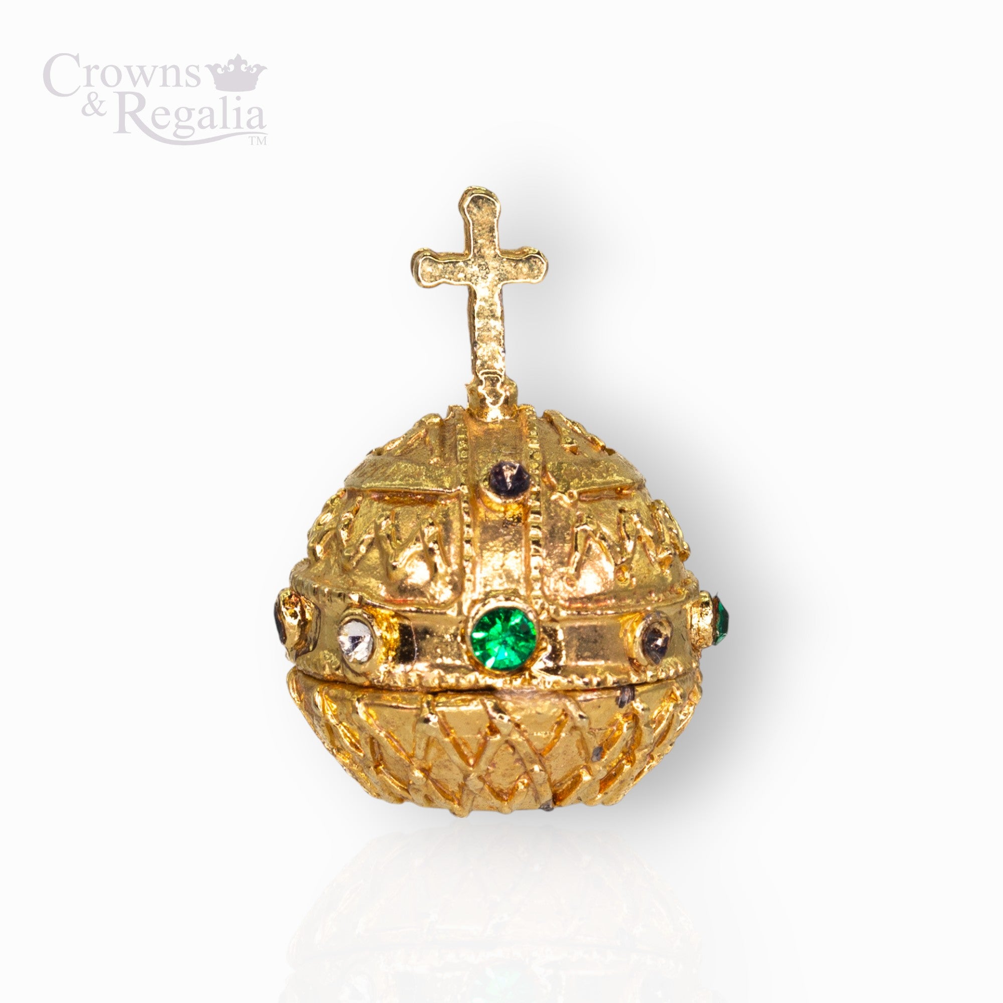Gold decorative sphere with a cross on top and green gemstones, branded 'Crowns & Regalia'.