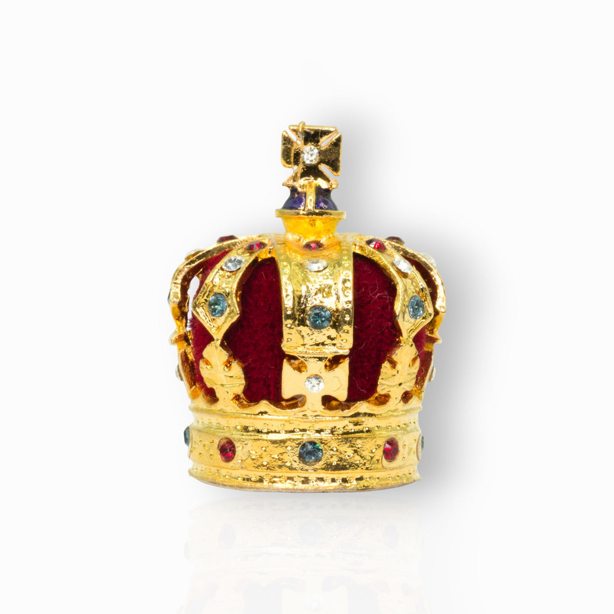 Gold crown with colourful stones on a white background.