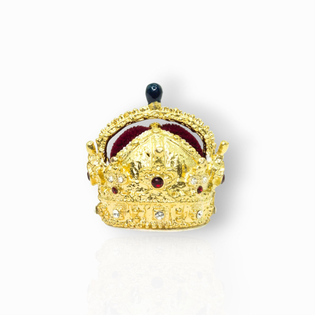 Gold crown with red stones on a white background.