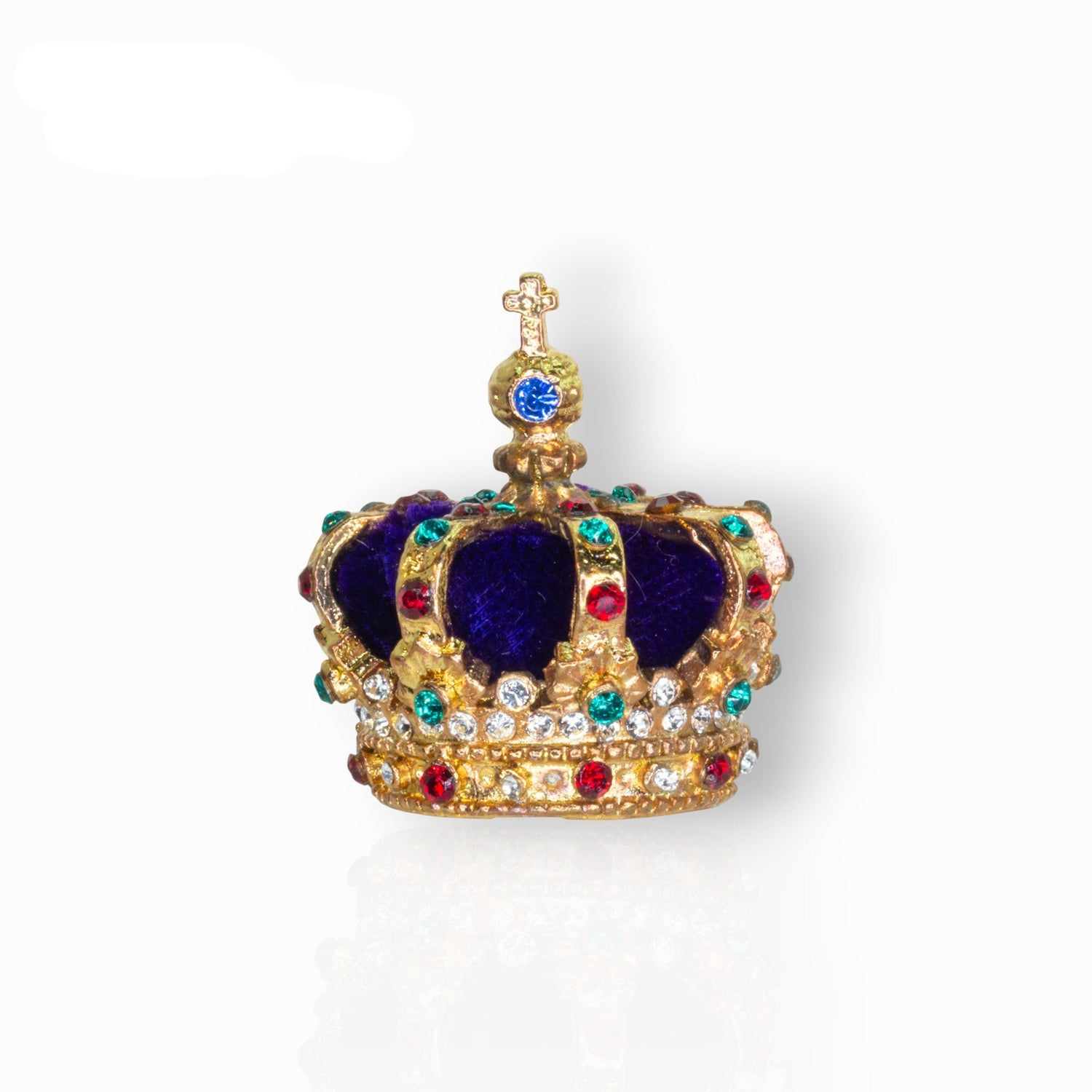 Decorative crown with blue velvet center and gold, red, and green jewels on a white background.