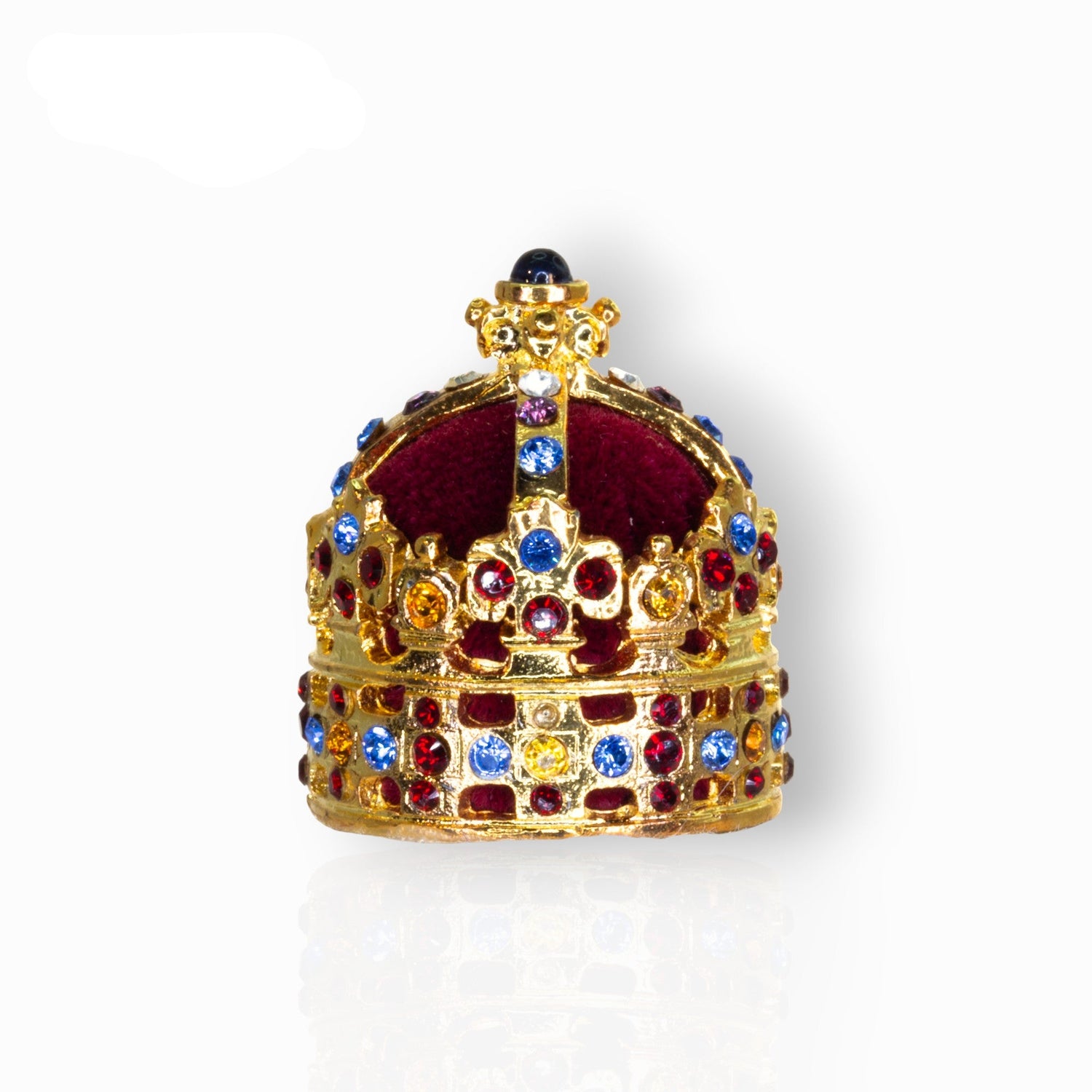 Decorative crown with colorful gemstones on a white background.