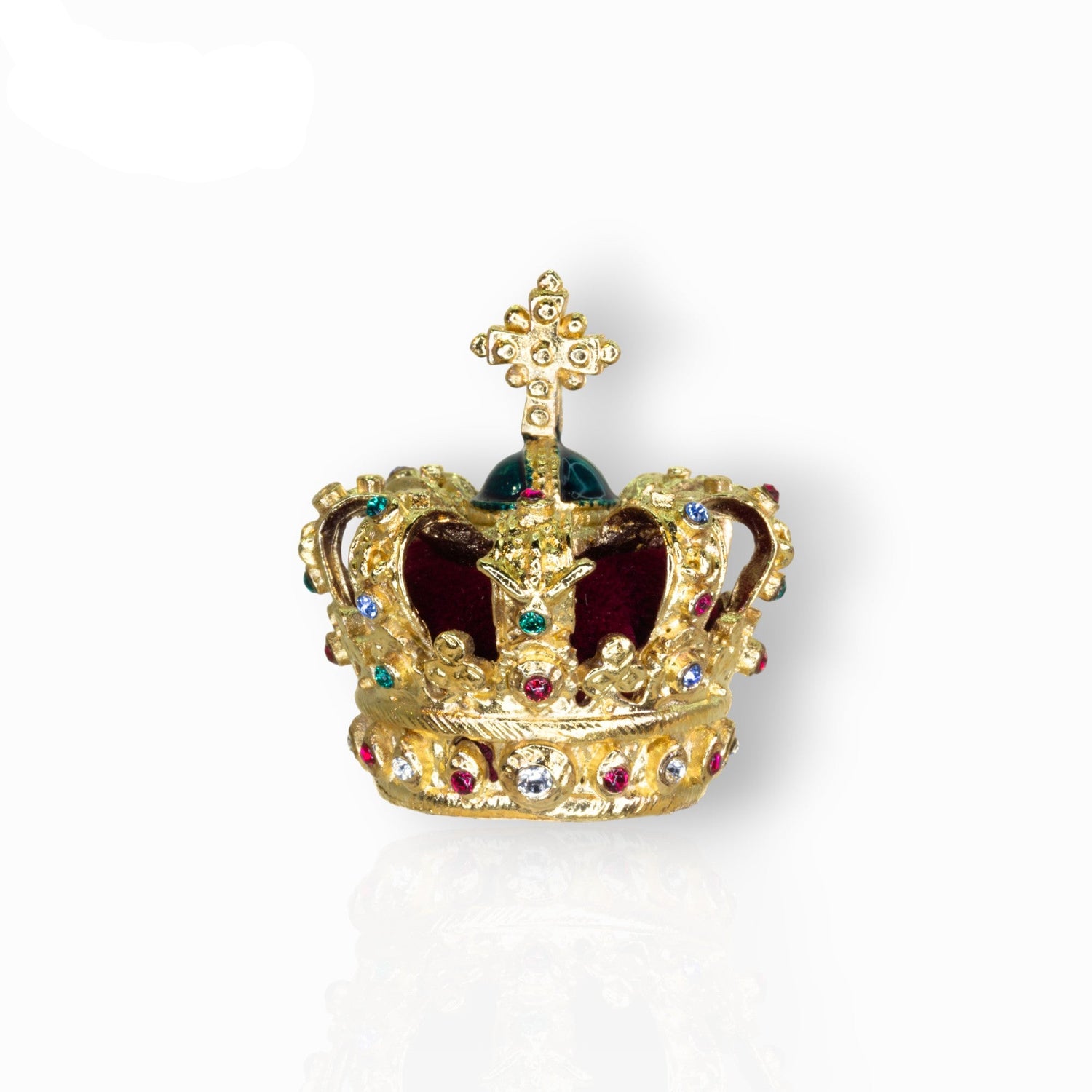 Gold crown with gemstones on a white background.