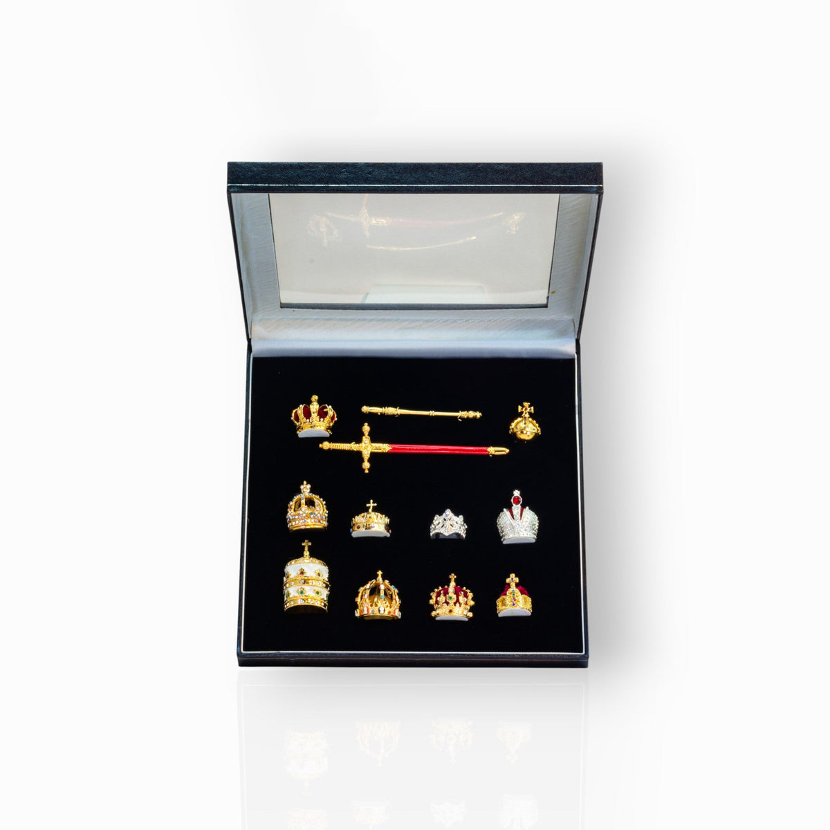Collection of crowns and a sword in a display box.