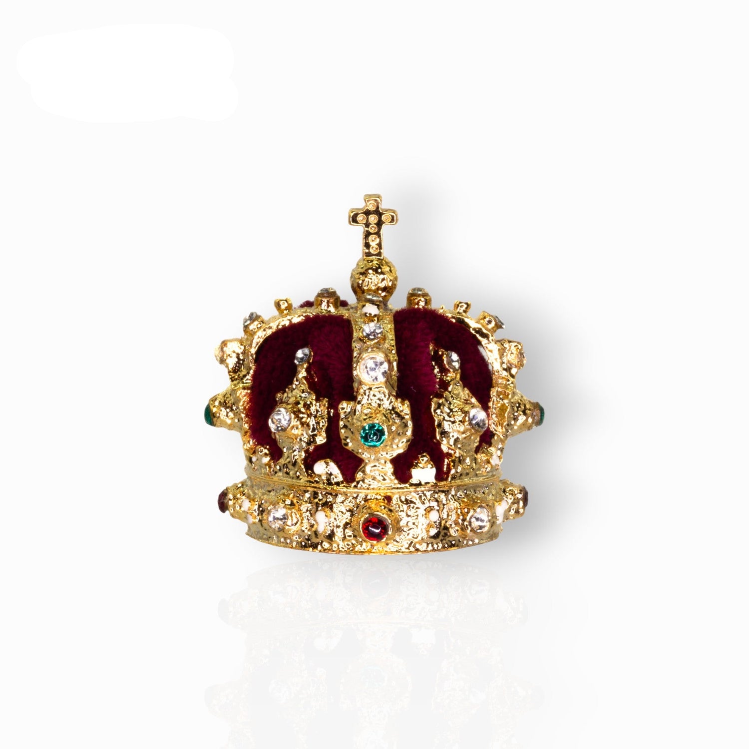 Decorative crown with gold and red details on a white background.
