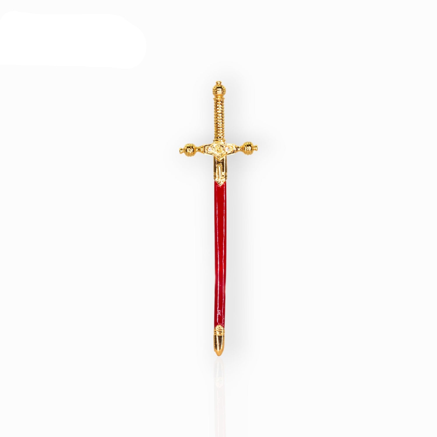 Decorative sword with gold hilt and red blade on a white background.