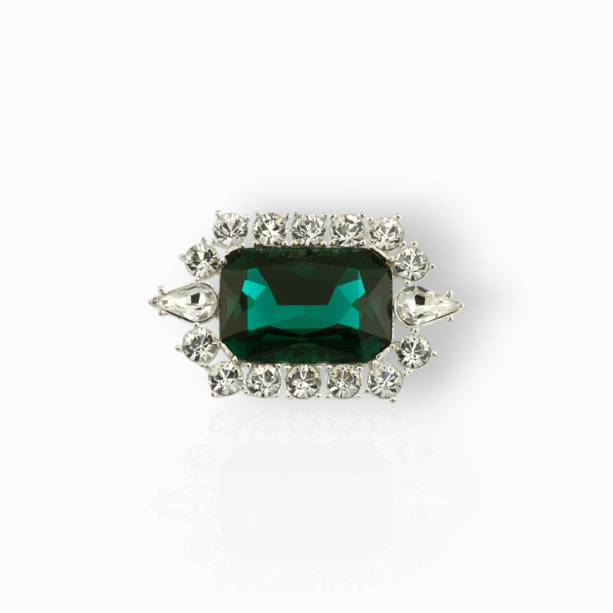 British Crown of India Emerald Crystal - Brooch on a white background.