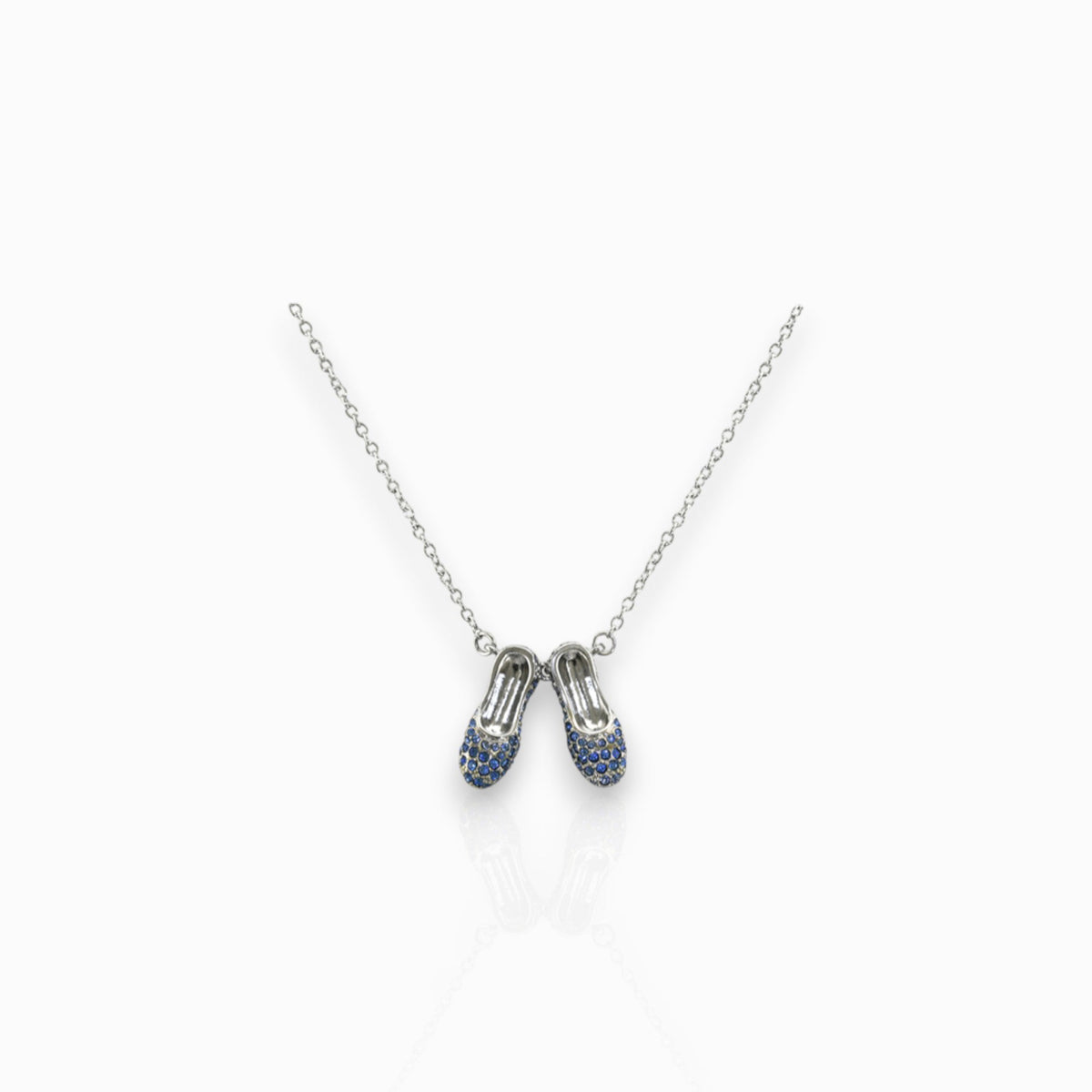 Wizard of Oz Dorothy Sapphire Slippers - Necklace on a white background.