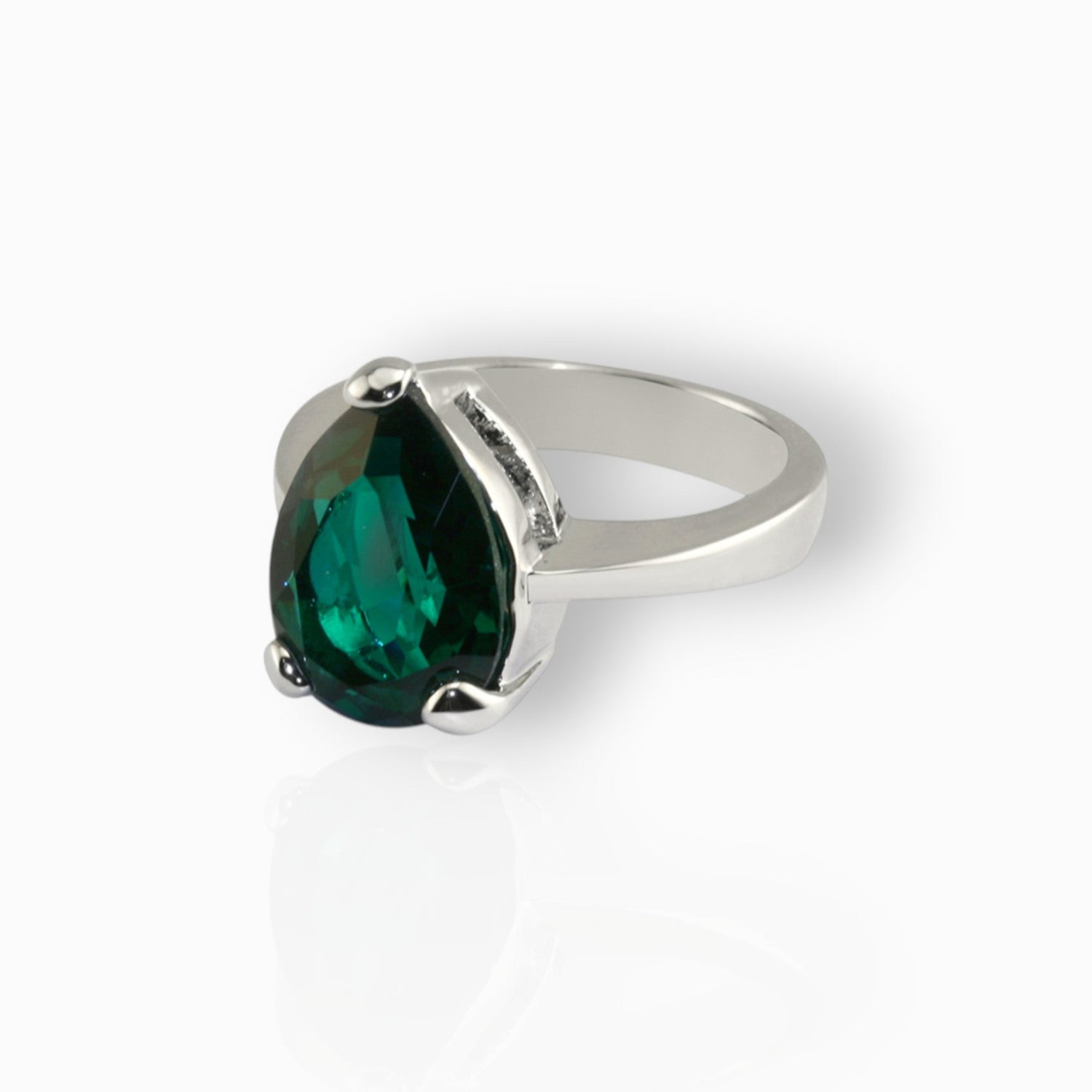 Queen Victoria's Emerald Crystal Collet Drop - Ring on a white background.