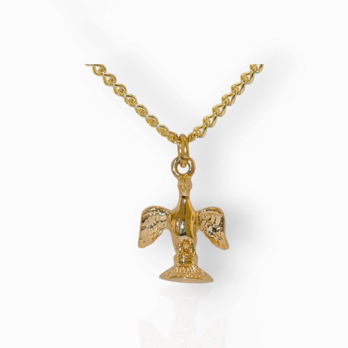 Gold pendant necklace with a detailed design on a white background.