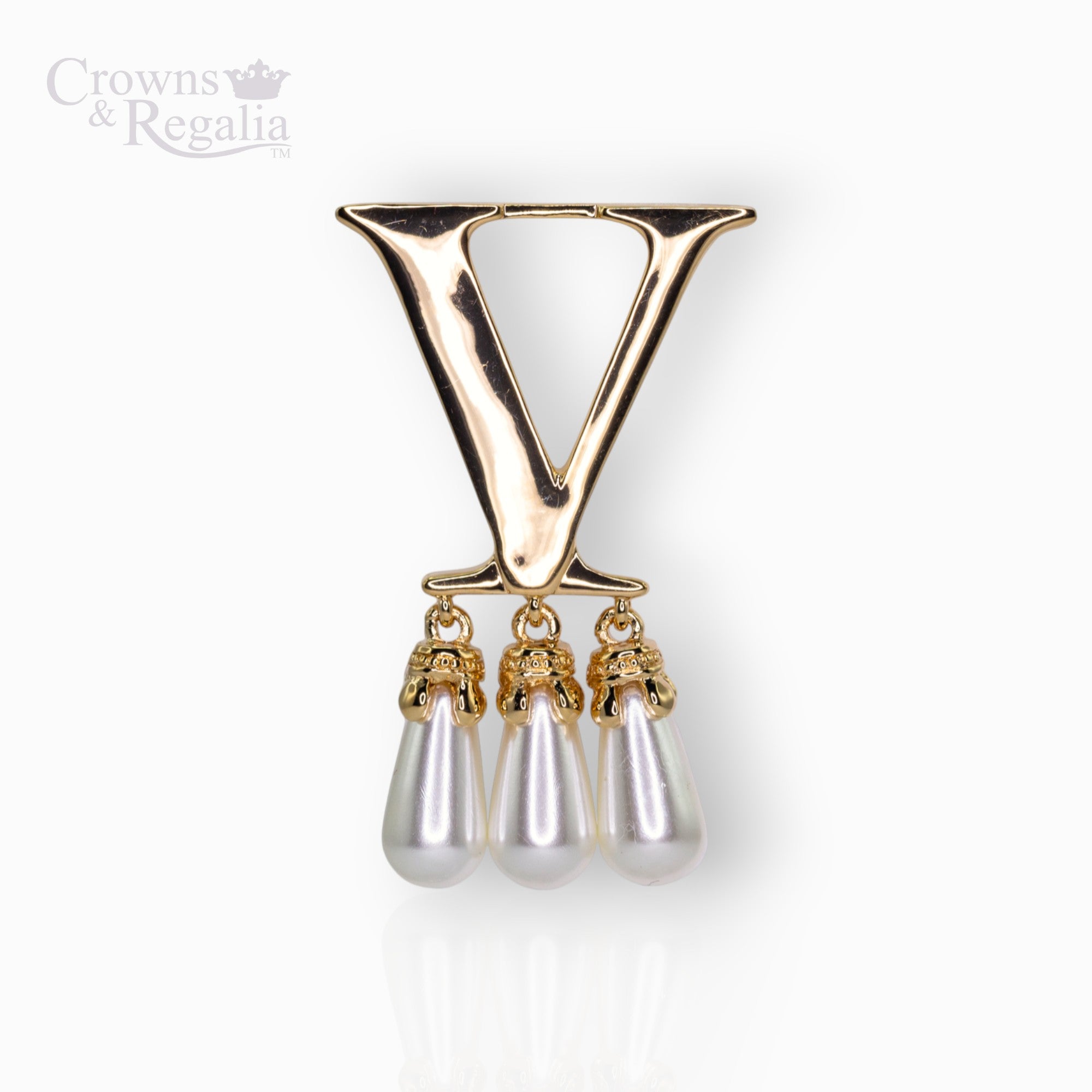 Gold brooch with 'V' and three pearl drops on a white background, branded 'Crowns & Regalia'.