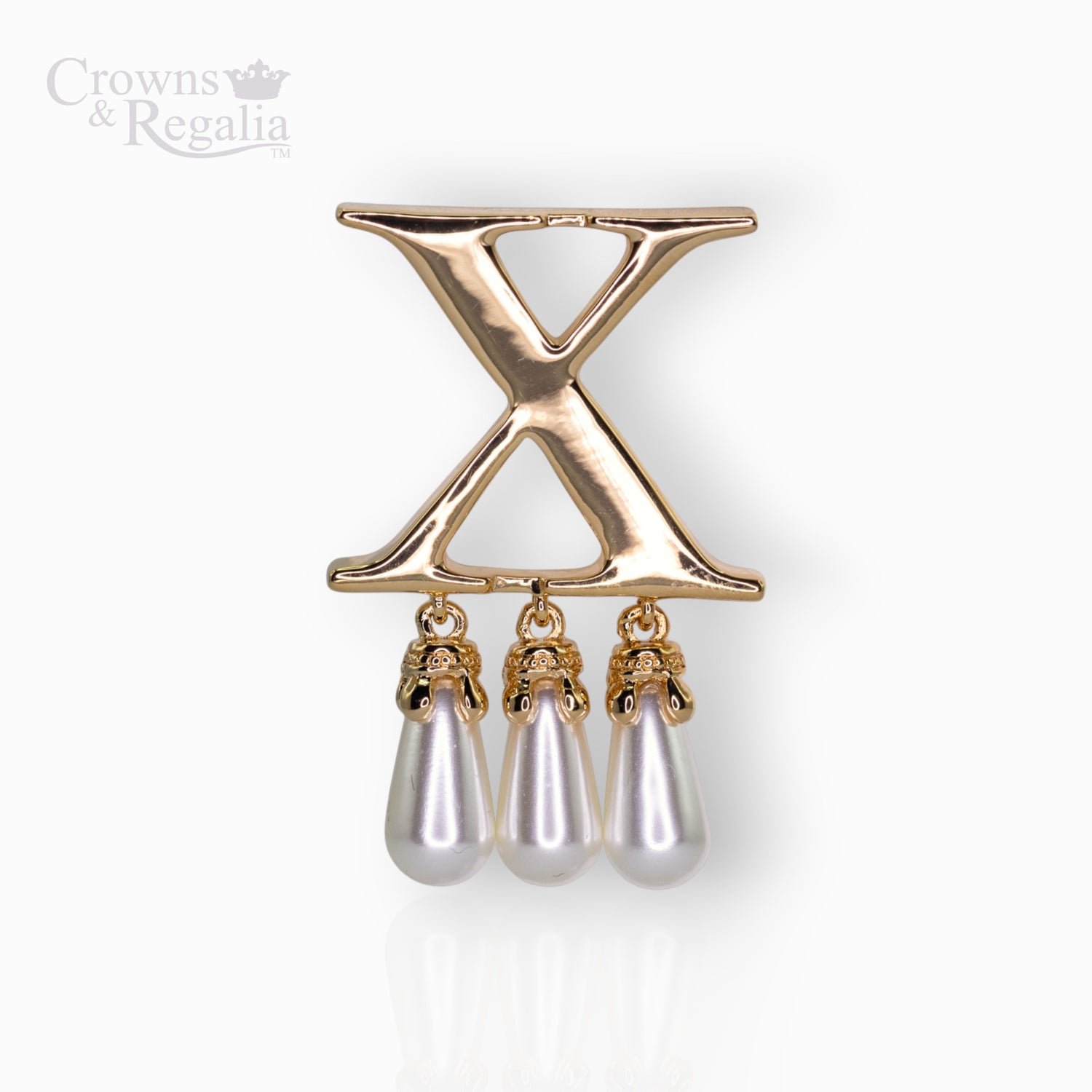 Gold brooch with 'X' design and pearl-like droplets on a white background, branded 'Crowns & Regalia'.