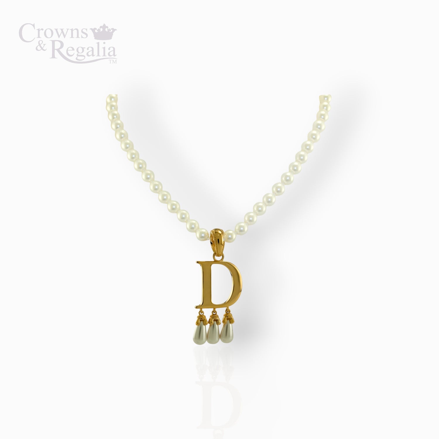 Pearl necklace with a gold pendant featuring the letter 'D' on a white background.