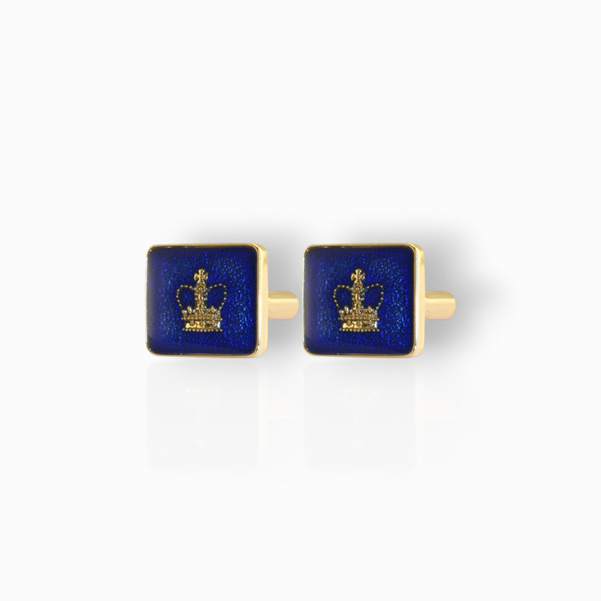 Gold and blue cufflinks with a crown design on a white background.
