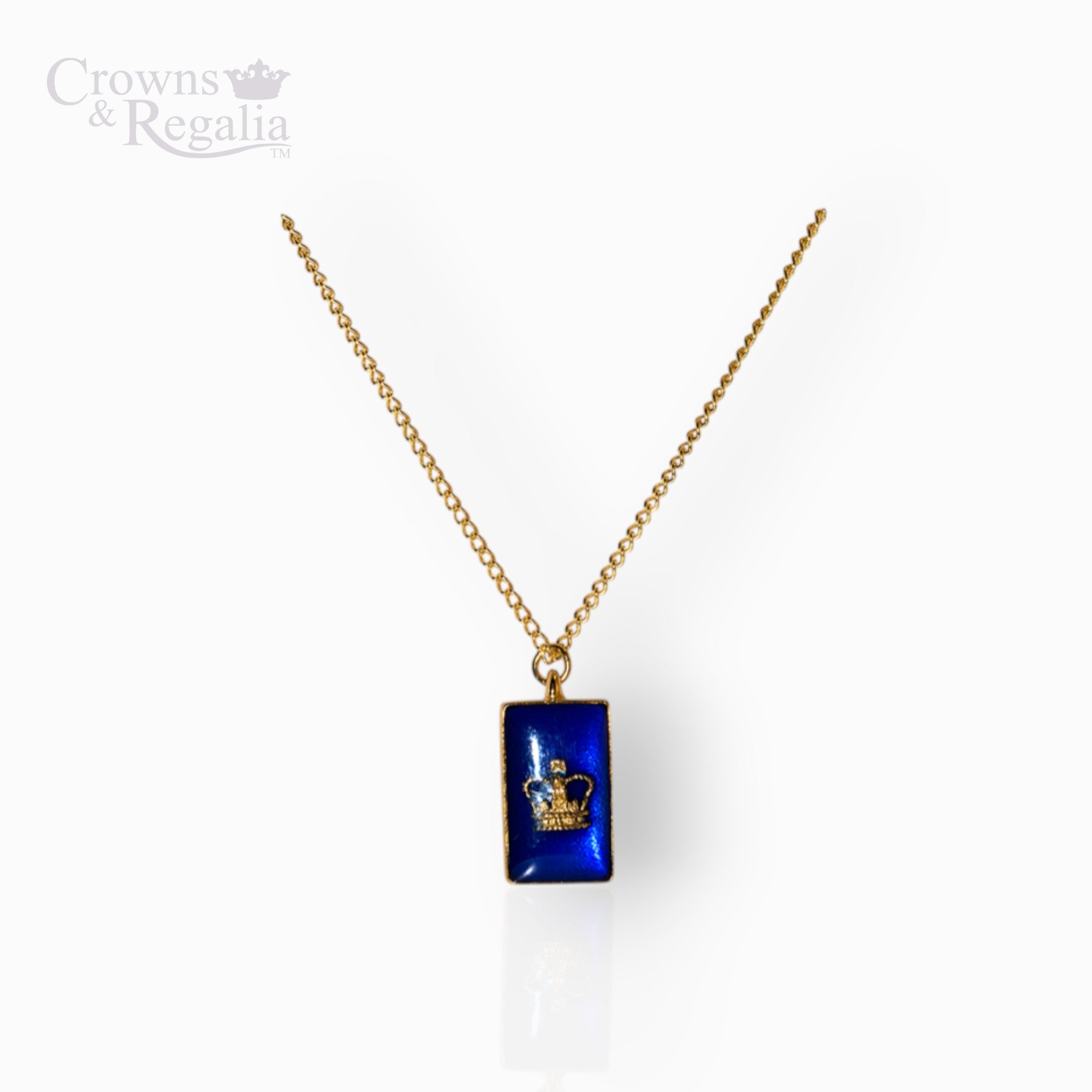 Gold necklace with a blue pendant on a white background, featuring 'Crowns & Regalia' branding.