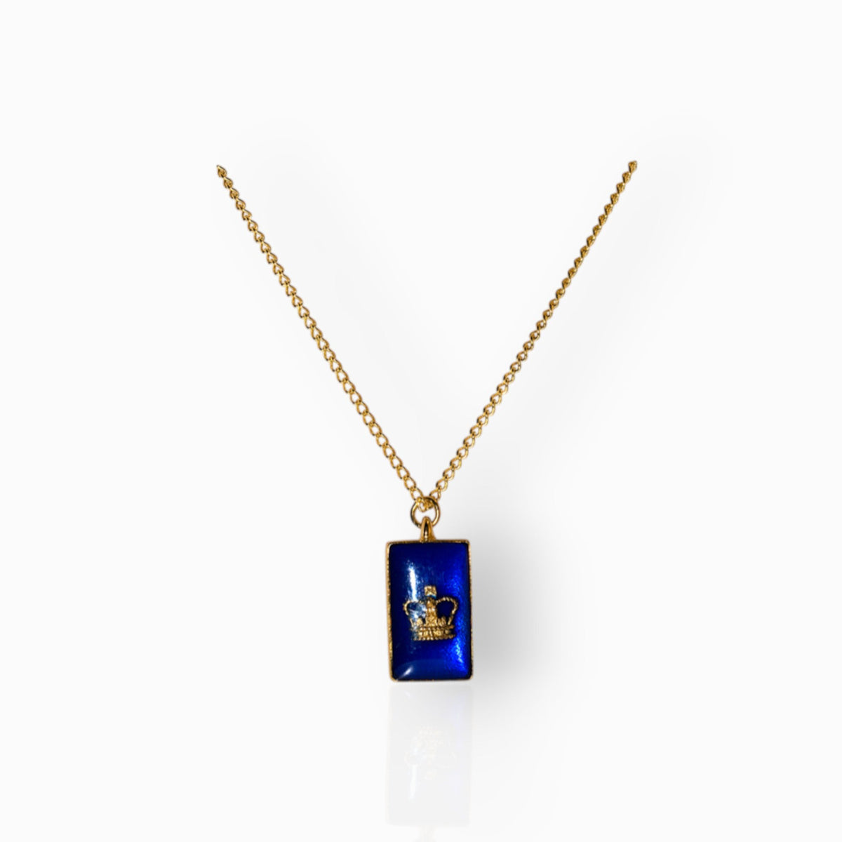 Gold necklace with a blue pendant on a white background.